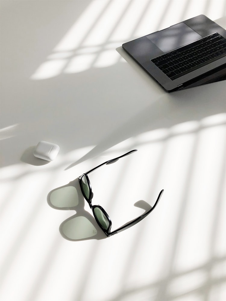 Picture of laptop and sunglasses